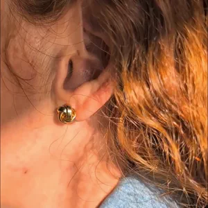 Video of Polished Love Knot Gold Stud Earrings